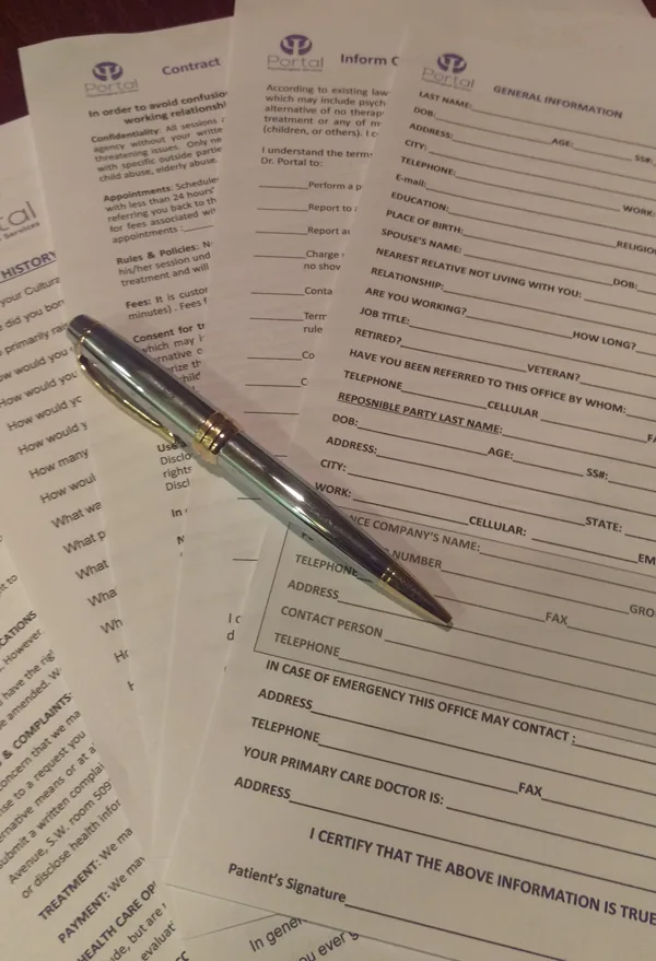 Printed patient intake forms with a pen